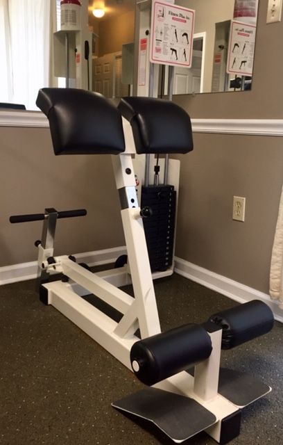Back extension rehabilitation machine